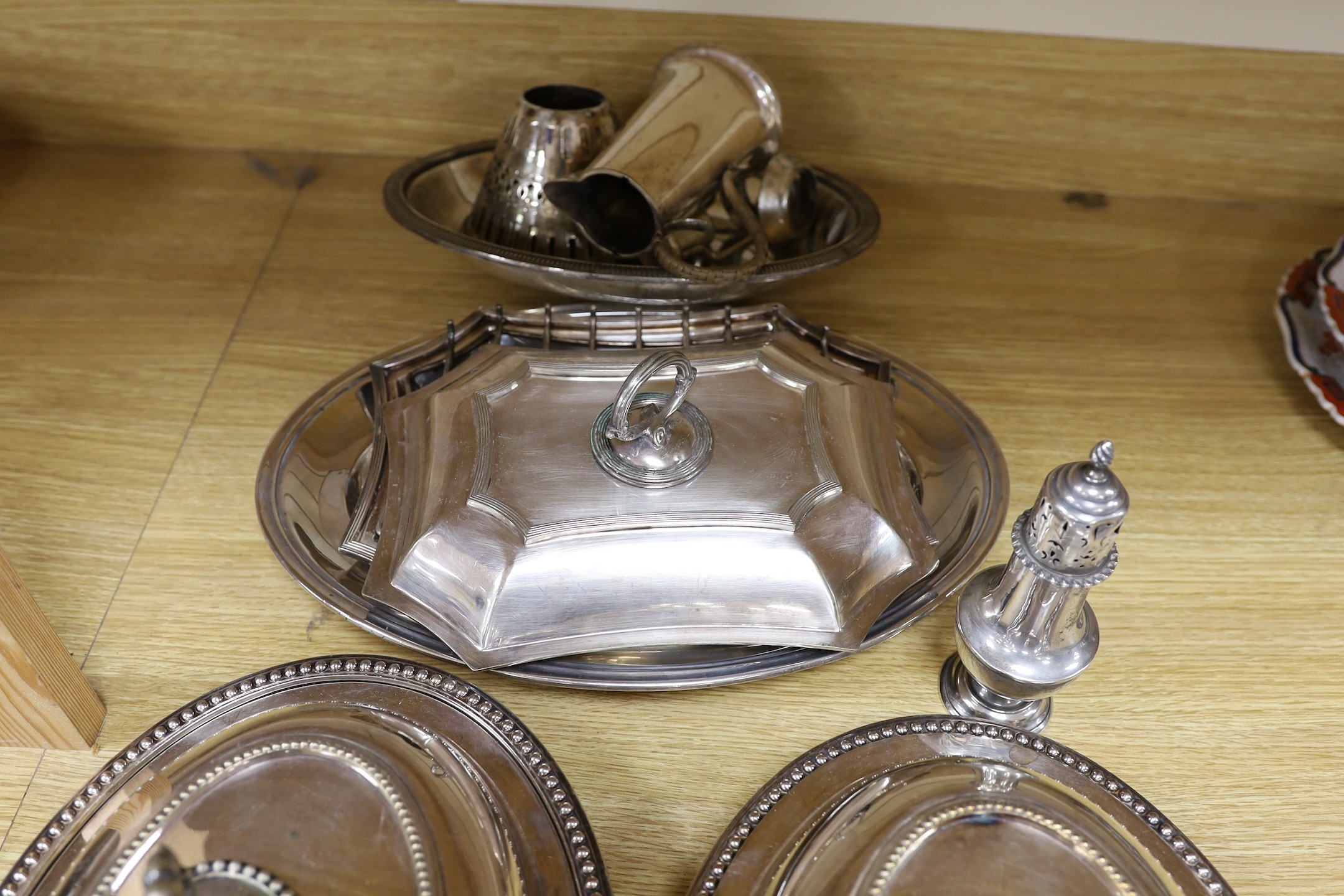 A silver sugar castor and sundry plated ware